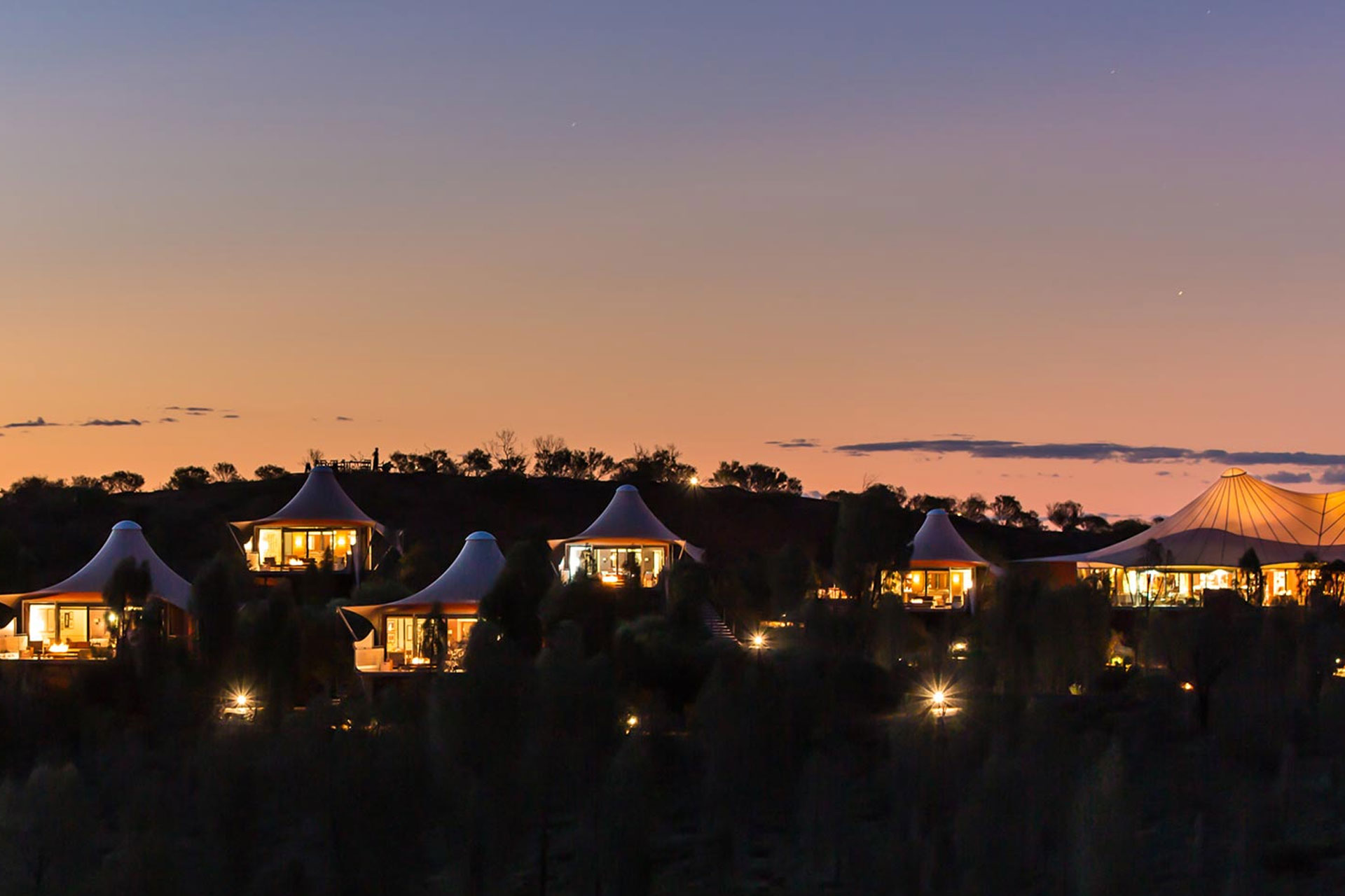 Tented pavilions at Australia's Longitude 131 at twilight