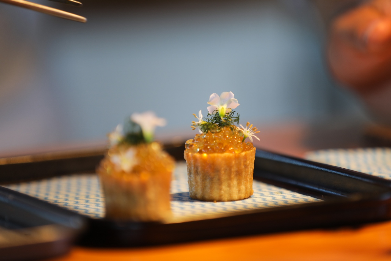 Smoked eel with onion and apple croustade by chef Jack Cashmore at Chef's Table at Blue Duck Station New Zealdn